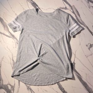 This a losse gray and white T-shirt. The T-shirt is a womens XS.